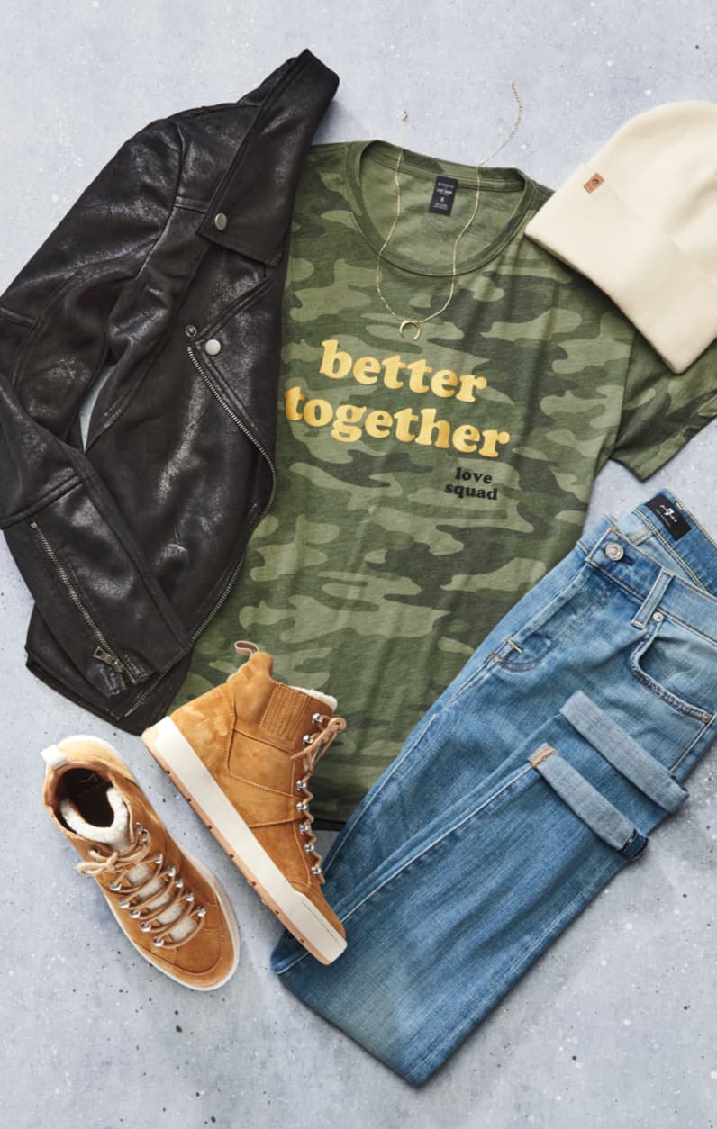 Lay down of leather jacket, camo tee, denim, a hat, and sneakers